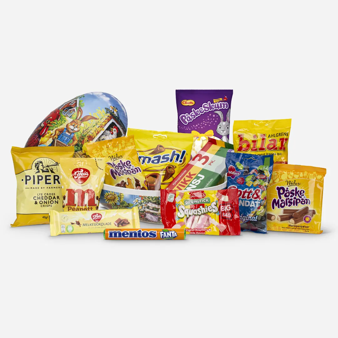 Påskeegg 30cm Innpakket 1,2kg - Innhold: Bilar 125g, Squashies drumstick 60g, 3-pack Kvikk Lunsj 141g, M 90g, Gott & Blandat 160g, Smash 100g, Nidar påskemarsipan 138 g, Melkesjokolade 100g, Mentos Fanta 37,5g, Marsipanpølser 5 stk 110g, Påskeskum 100g, Pipers Cheddar & onion 40g Påskeegg delt i to. Liggende, fylt med påskeklassikere fra blant annet freia og cloetta