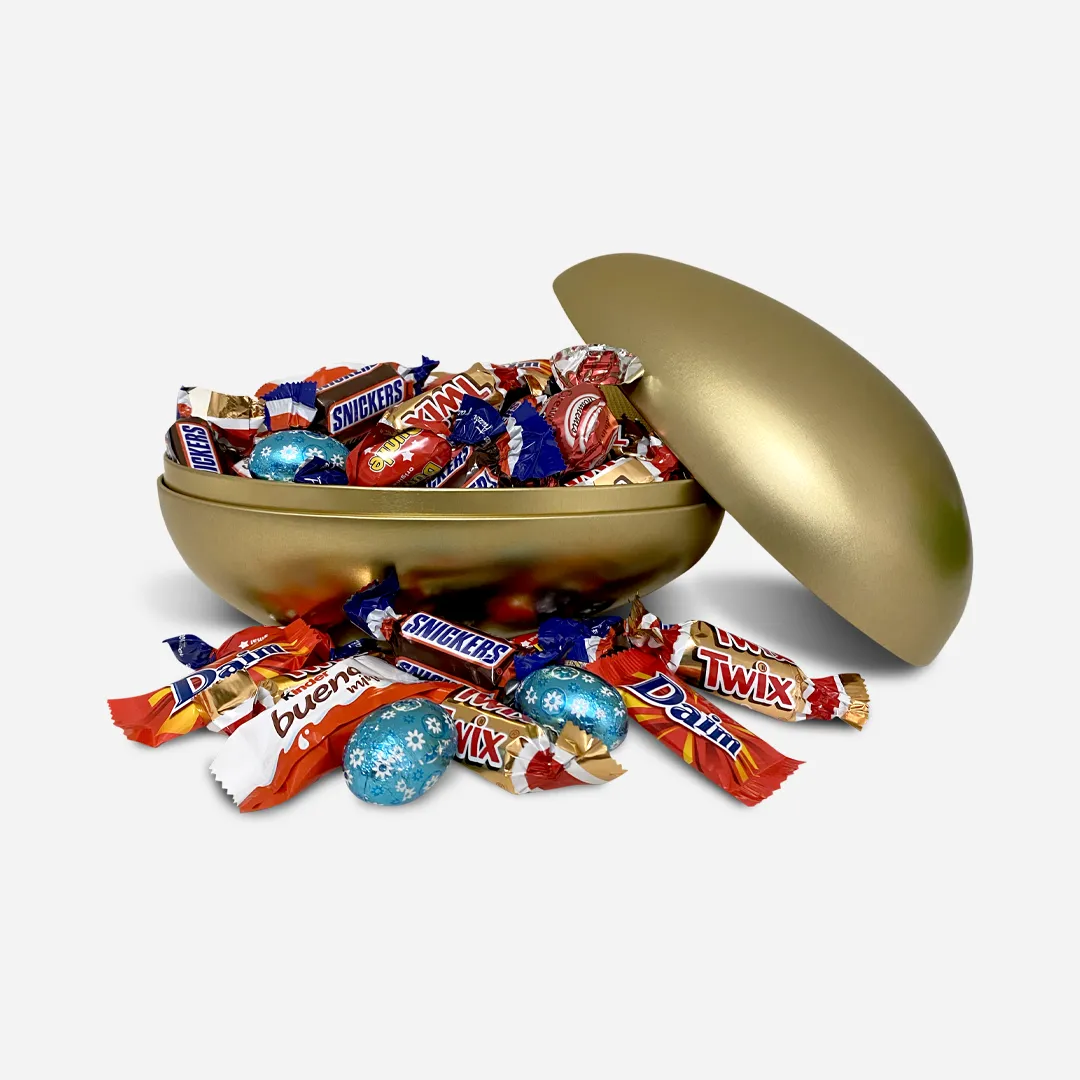 Gullegg 18cm Sjokolade 400g - Innhold: Melkesjokolade 400g Gullegg delt i to, fylt med innpakkede sjokoladebiter. Samt noen liggende utenfor